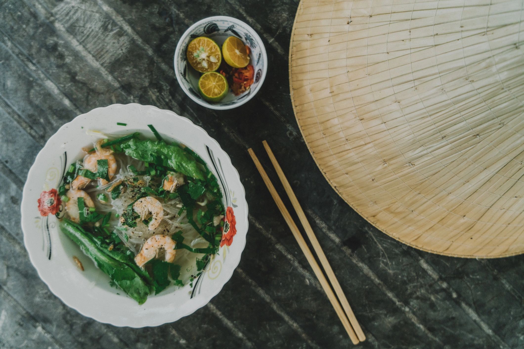 Shrimp pho served in a bowl on a table